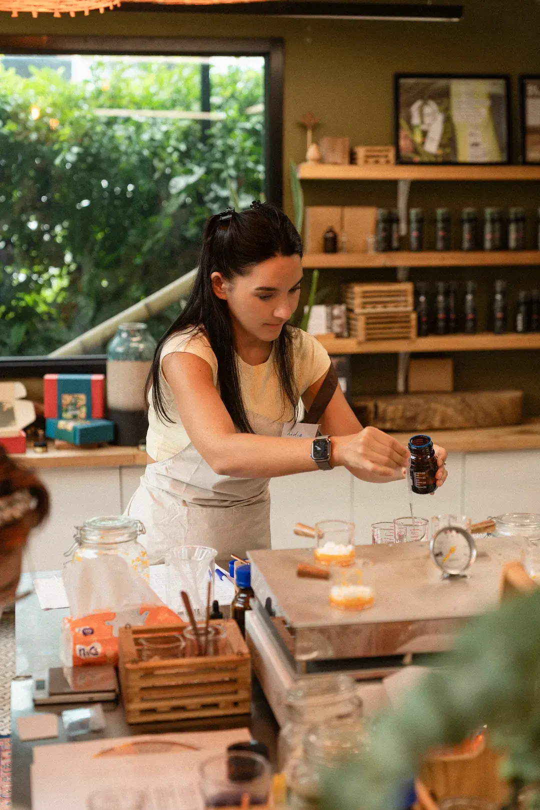 Adding woody base notes in a natural perfume workshop Phuket