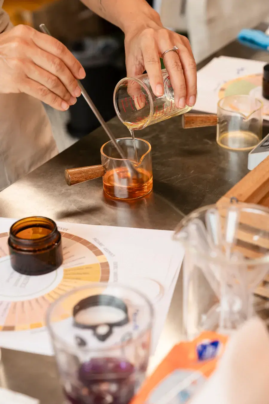 Custom perfume workshop Phuket — blending essential oils at the formulator bench